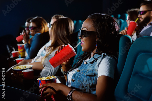 Young African woman watching a 3D movie