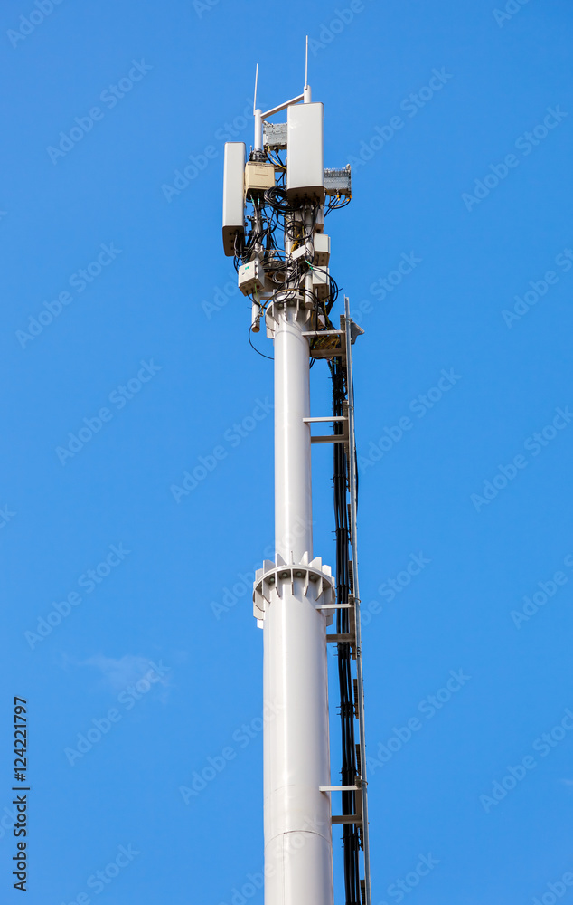 Telecommunication tower for mobile phone with antennas over a bl Telecommunication tower for mobile phone with antennas over a bl