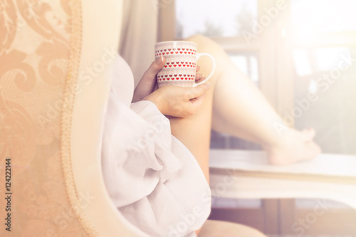 woman sipping coffee in a magic moment of quiet photo