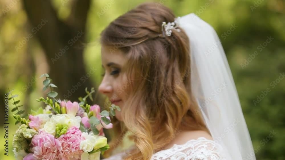 Bride holding her wedding bouquet in slow motion Bride holding her wedding bouquet in slow motion