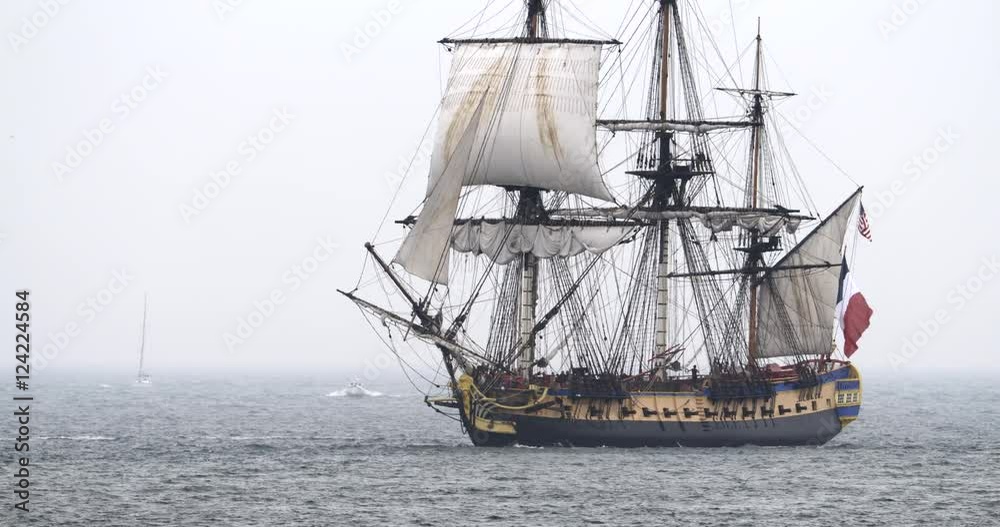 Traditional style tall ship vessel sailing in sea