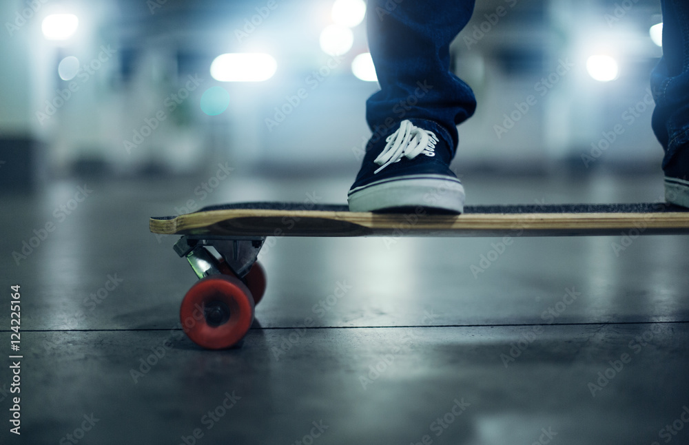 Fototapeta premium Skateboarder foot on longboard