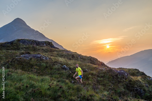 Trailrunner in the Scottish Highlands at Loch Leven, Great Brittain