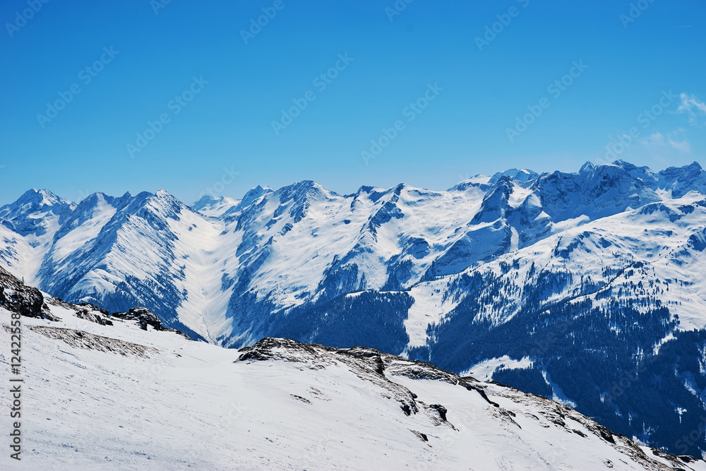 Snowy slopes in winter mountains. Skiing resorts