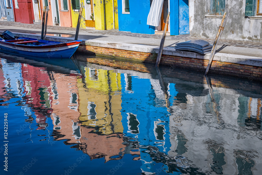 Fototapeta Reflections of colorful houses in canal, Island of Burano, Italy
