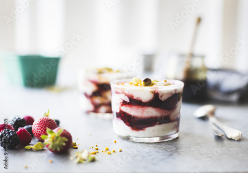 Summer berries yogurt fool dessert with buckwheat honey photo