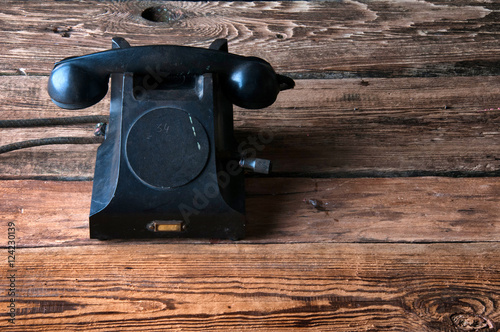 Wallpaper Mural Old-fashioned landline telephone on dark wooden background Torontodigital.ca