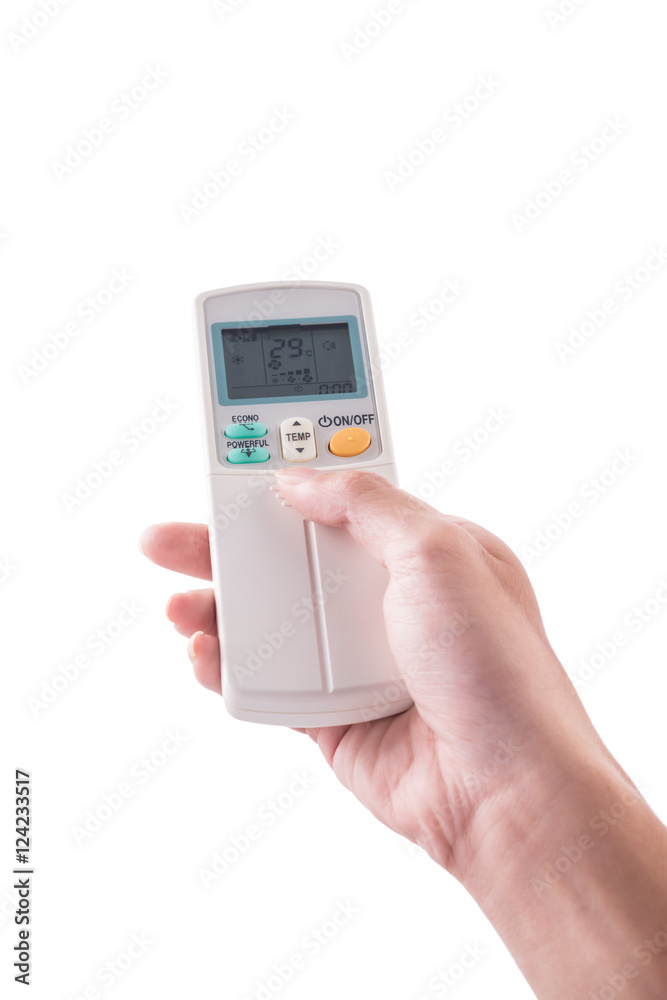Right hand holding remote air conditioner turn up to 27 celcius Right hand holding remote air conditioner turn up to 27 celcius