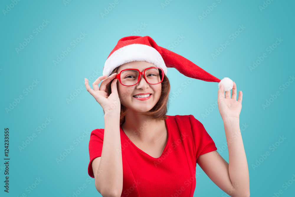 Smiling asian woman portrait with christmas santa hat isolated o Smiling asian woman portrait with christmas santa hat isolated o