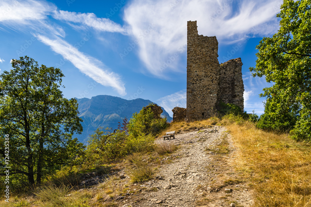 Ruins of Saint-Firmin castle (14th century medieval construction) at the entrance of Valgaudemar valley in the Hautes-Alpes. Summer in the Southern French Alps. France