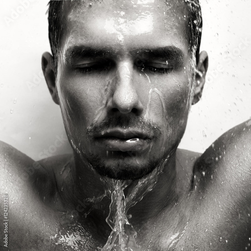 Portrait of a man in the rain. Black and white.