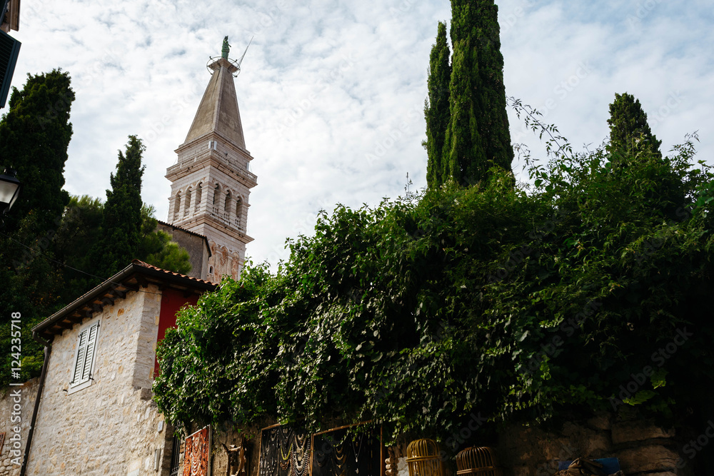 View of the tower of Church of St. Euphemia from the lane in the historic town of Rovinj, Croatia.