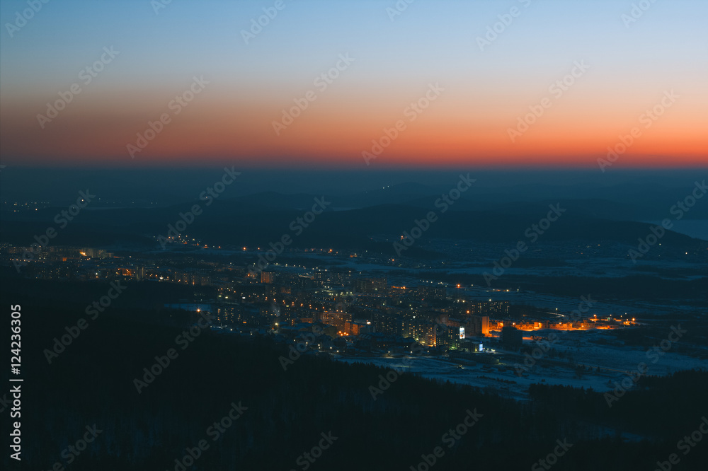 Night view of the city in a mountain valley.