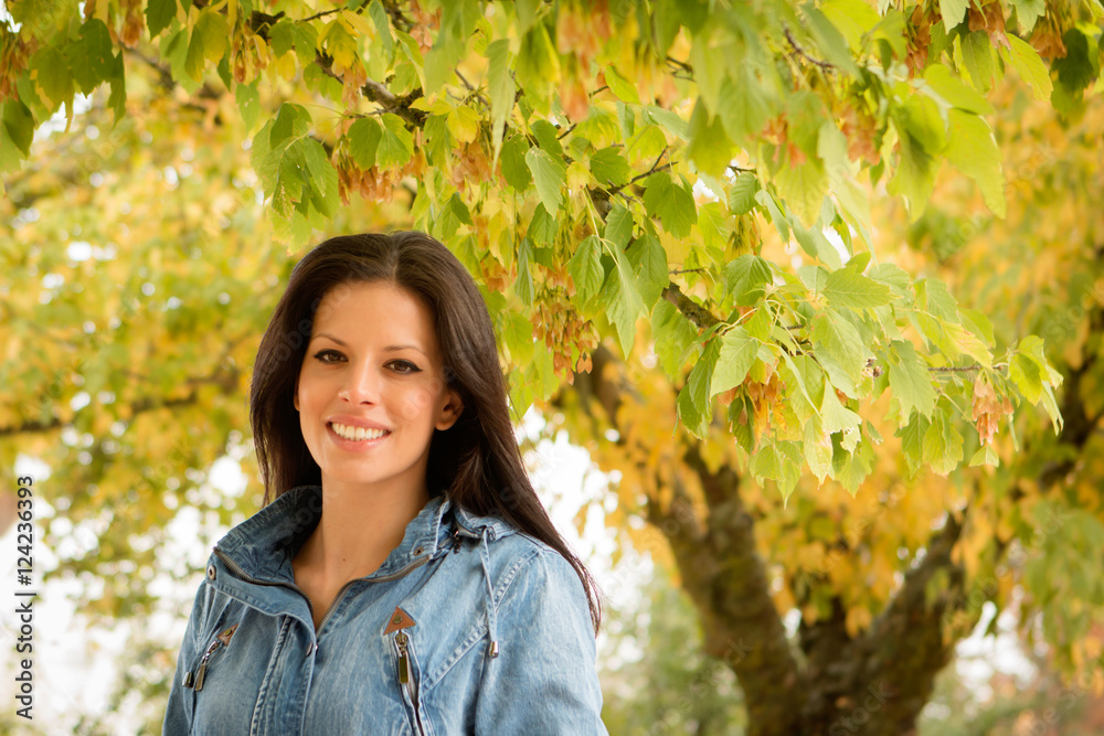 Beautiful brunette girl taking a walk in autumn Beautiful brunette girl taking a walk in autumn