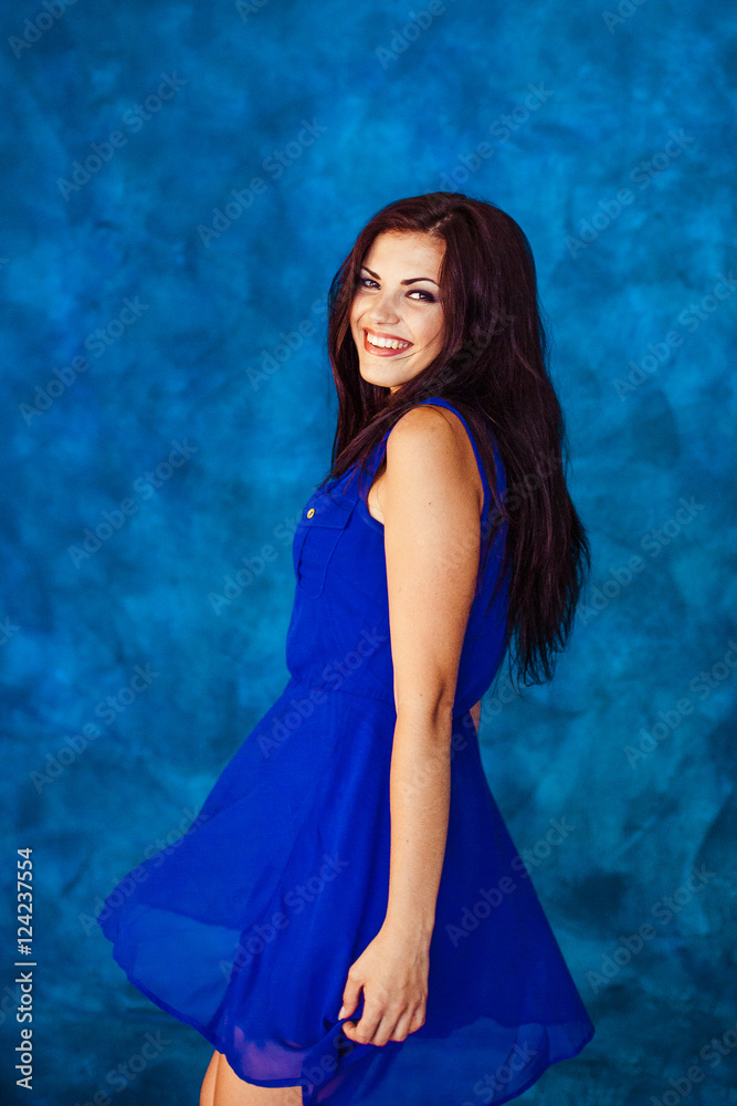 Fabulous woman with long hair looks over her shoulder Fabulous woman with long hair looks over her shoulder