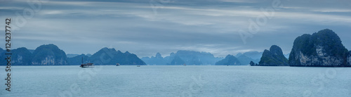 Early morning landscape with blue fog and tourist junks floating among limestone rocks at Ha Long Bay, South China Sea, Vietnam, Southeast Asia. Travel background, four images panorama © PerfectLazybones