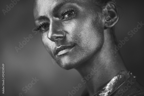 Black and white portrait of a model with shining face