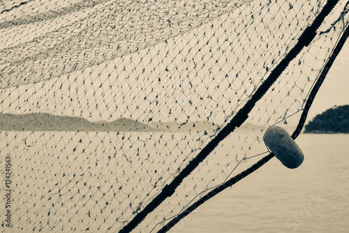 Fishing net of a boet in the southeast of Brazil photo