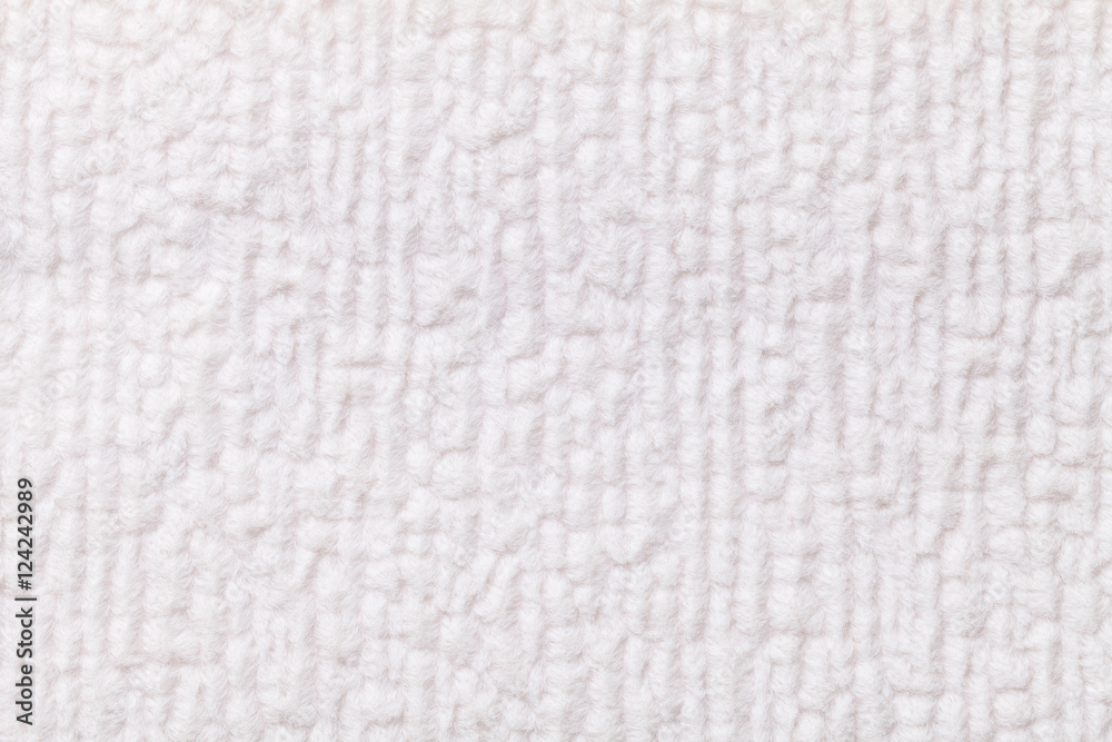 White fluffy background of soft, fleecy cloth. Texture of textile closeup. White fluffy background of soft, fleecy cloth. Texture of textile closeup.
