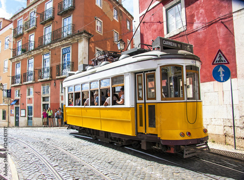Famous old yellow tram on street of Lisbon/Lisboa.