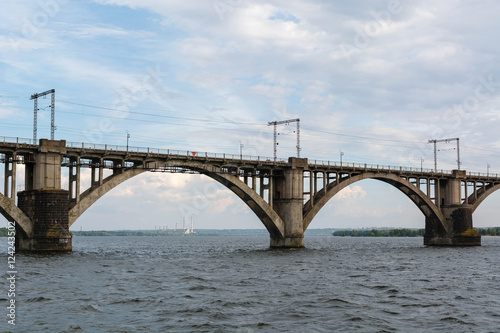 High arched railway bridge made of concrete across the Dnieper River in the city of Dnepropetrovsk. Ukraine, 5 June 2016