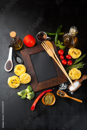 Fototapeta Naklejka Na Ścianę i Meble -  Raw pasta and ingredients for pasta