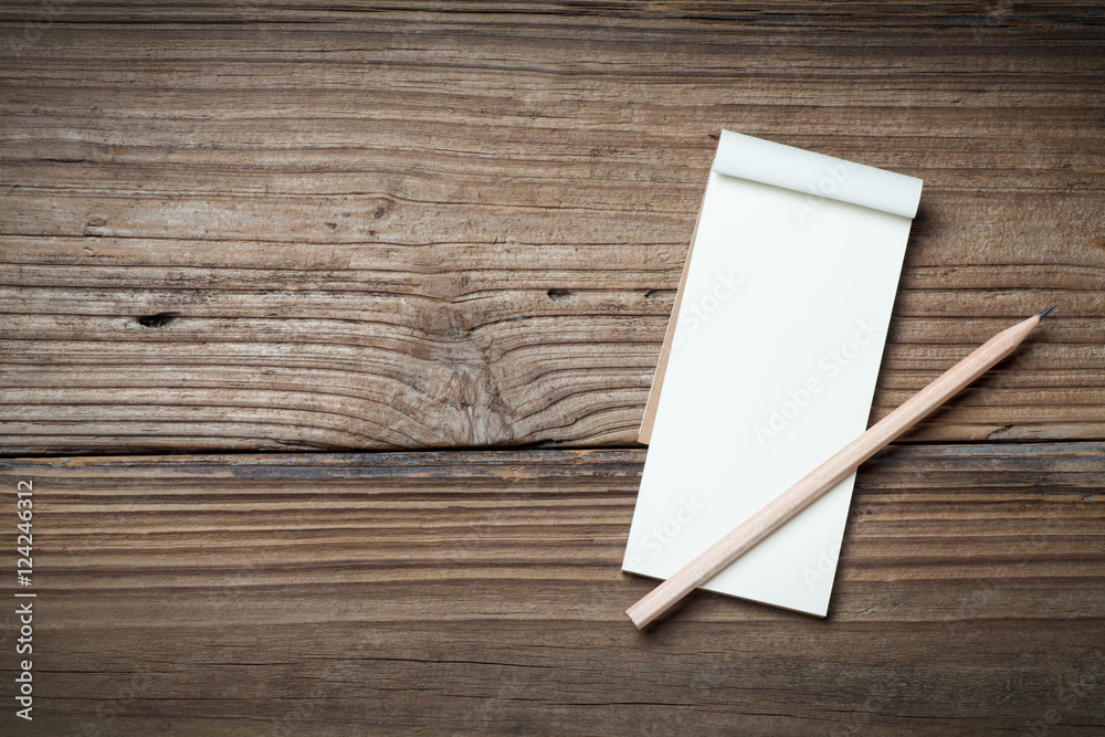 Blank notebook and pencil on old wood table Blank notebook and pencil on old wood table