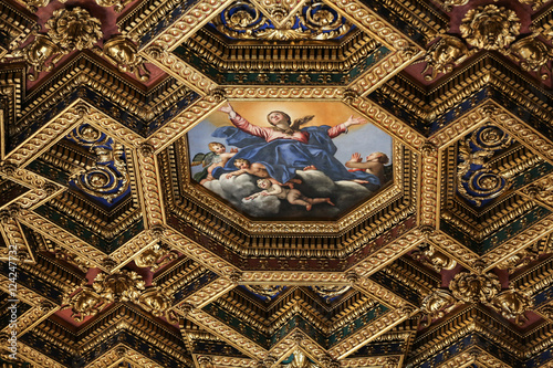  interiors and architectural details of basilica di Santa Maria in Trastevere in Rome, Italy. Octagonal ceiling painting Assumption of the Virgin by Domenichino