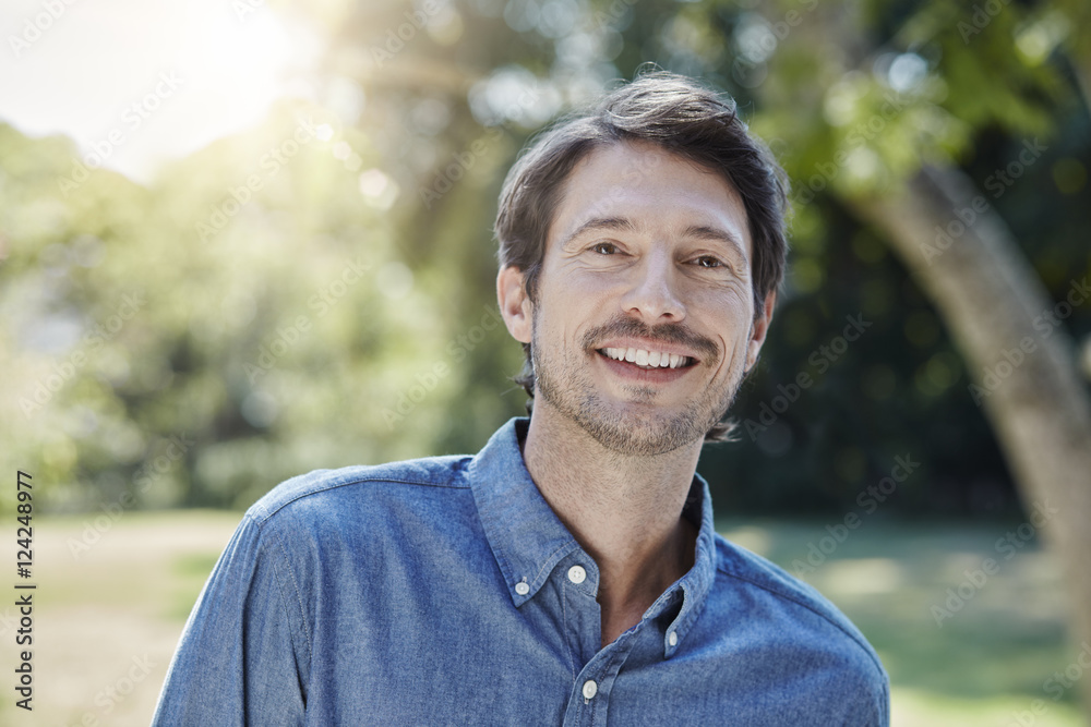 Portrait of smiling man in park Portrait of smiling man in park