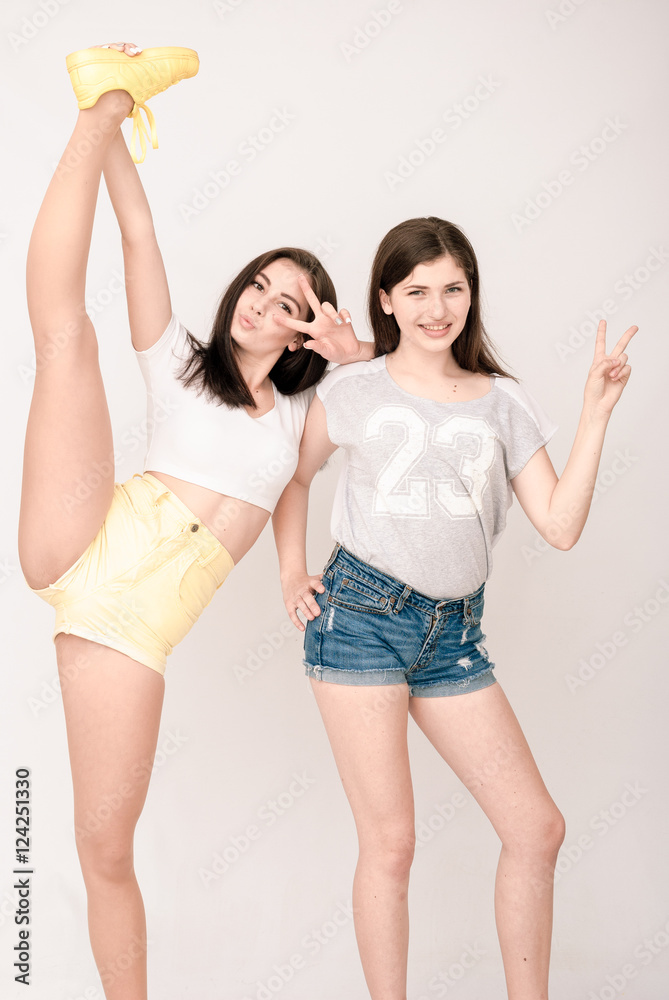 Positive friends portrait of two girls, funny faces, grimaces Positive friends portrait of two girls, funny faces, grimaces