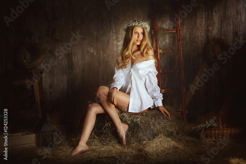 Beautiful woman on hayloft