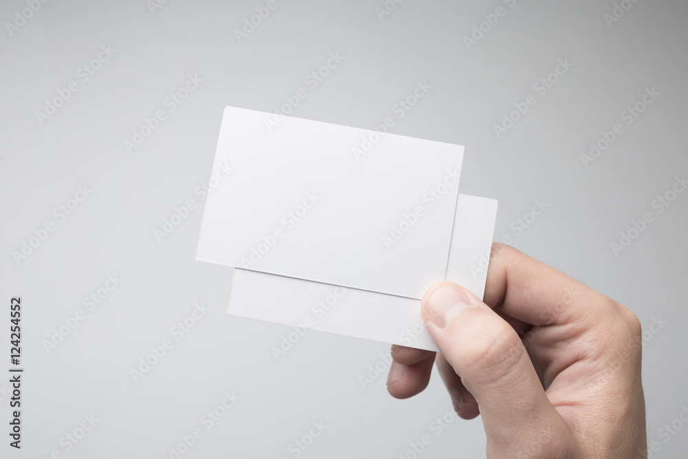 Hand holding Blank Business Card Mock-up.