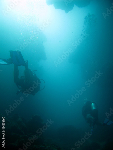 Scuba divers in deeper waters
