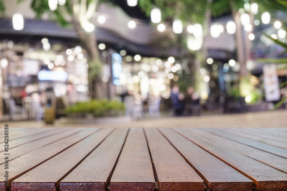 Empty wooden table space platform and blurred resturant background for product display montage