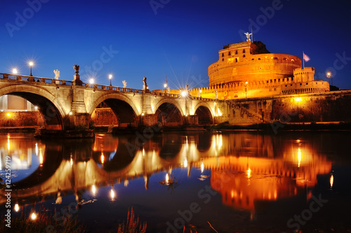 Rome, Italy - Castel Sant'Angelo (Mausoleum of Hadrian) and bridge over river Tiber at night