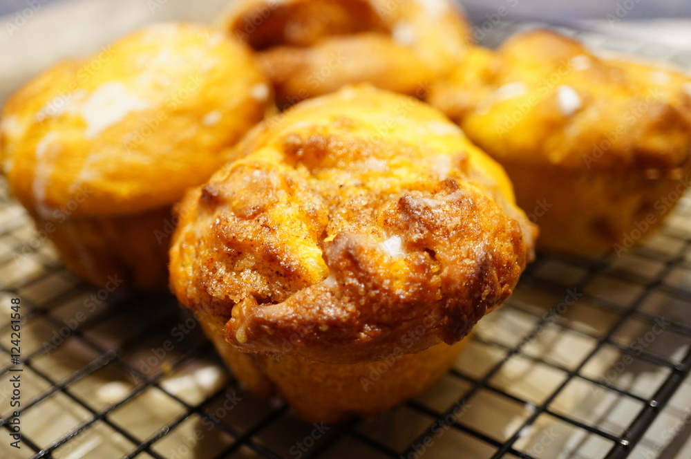 Pumpkin cinnamon rolls freshly baked in muffin tins