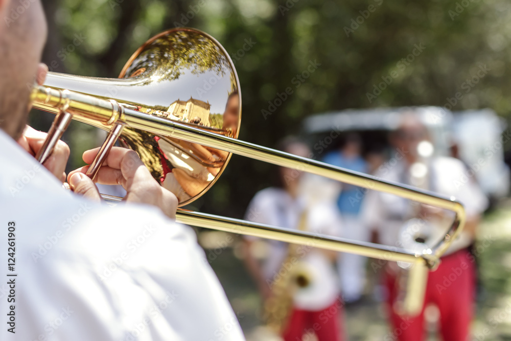 Fototapeta premium Hands of man playing the trumpet at outdoor