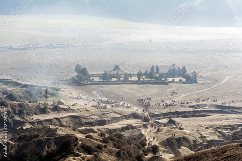 Obraz na plátně Looking down at the misty morning of caldera sea-sand plain from Mount Bromo