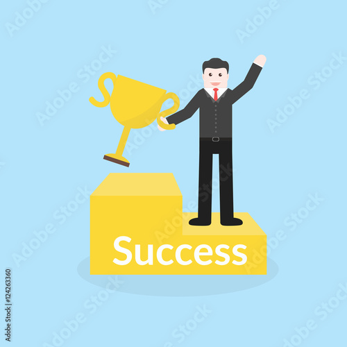 Success concept by business man holding trophy and stood on the