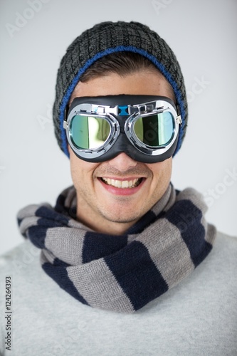 Man in winter clothing wearing aviator goggles