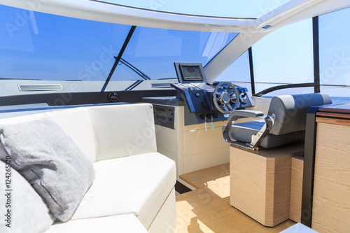 cockpit interior of luxury motoryacht at sunset