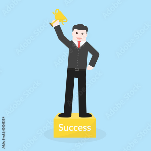 Success concept by business man holding trophy and stood on the