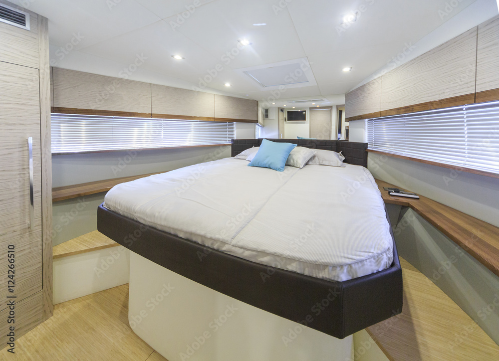interior of luxury motoryacht, bedroom cabin