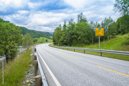 Road in Norway along the forest and river