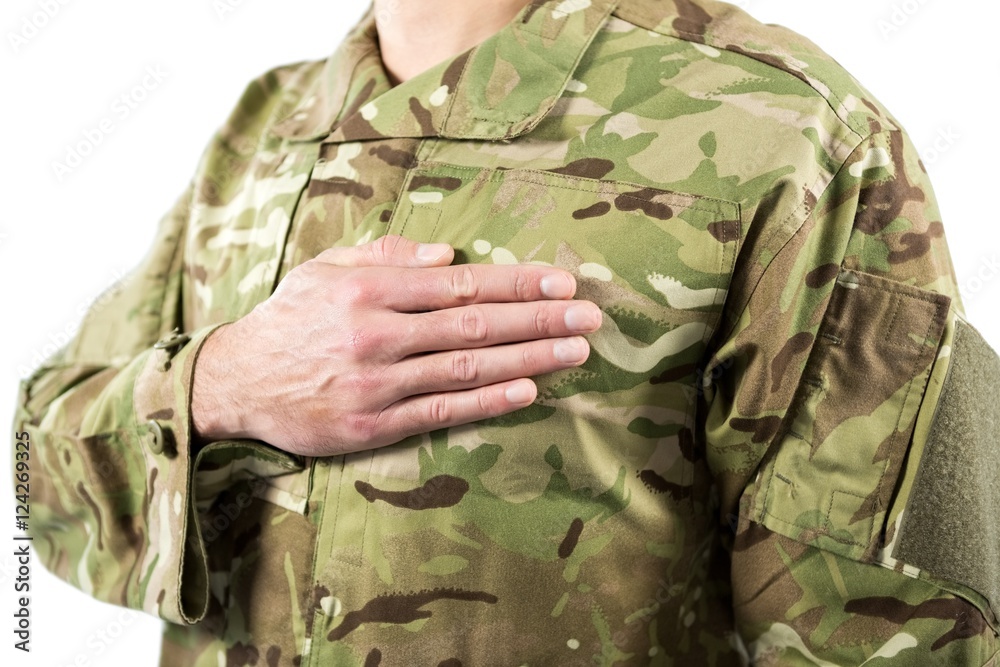 Mid section of soldier taking oath