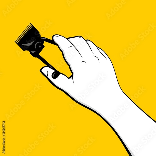 Barber hand holding vintage hair clipper