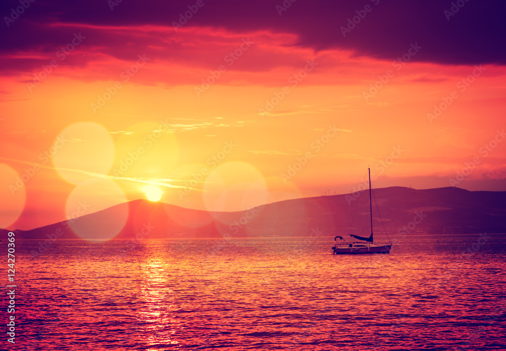 Sailing Yacht in Calm Bay. Sunset Seascape.