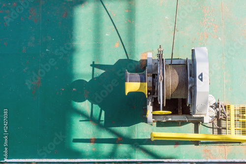 Photography Air tugger winch on the bow of a construction barge