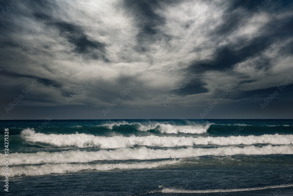 Stormy ocean landscape with rainy clouds