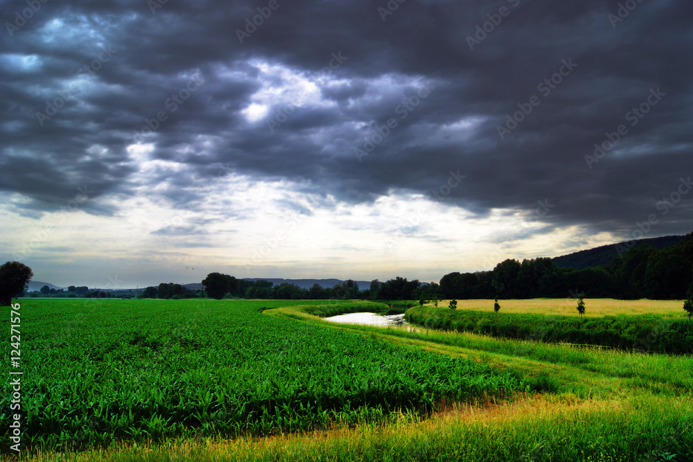 River valley before the summer storm River valley before the summer storm